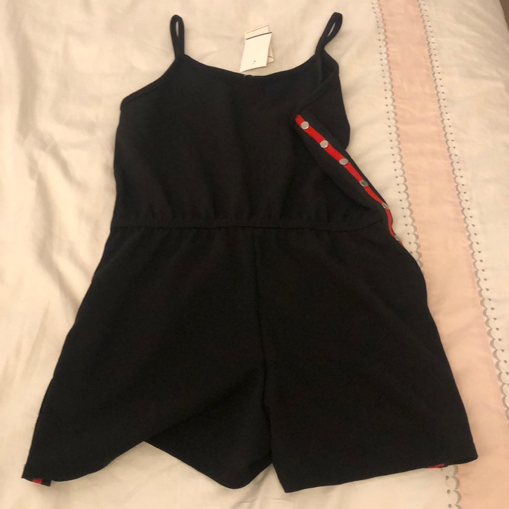 Romper with red sides and snaps